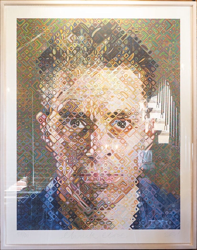 A framed mosaic portrait that hangs in the mansion's stair hall
